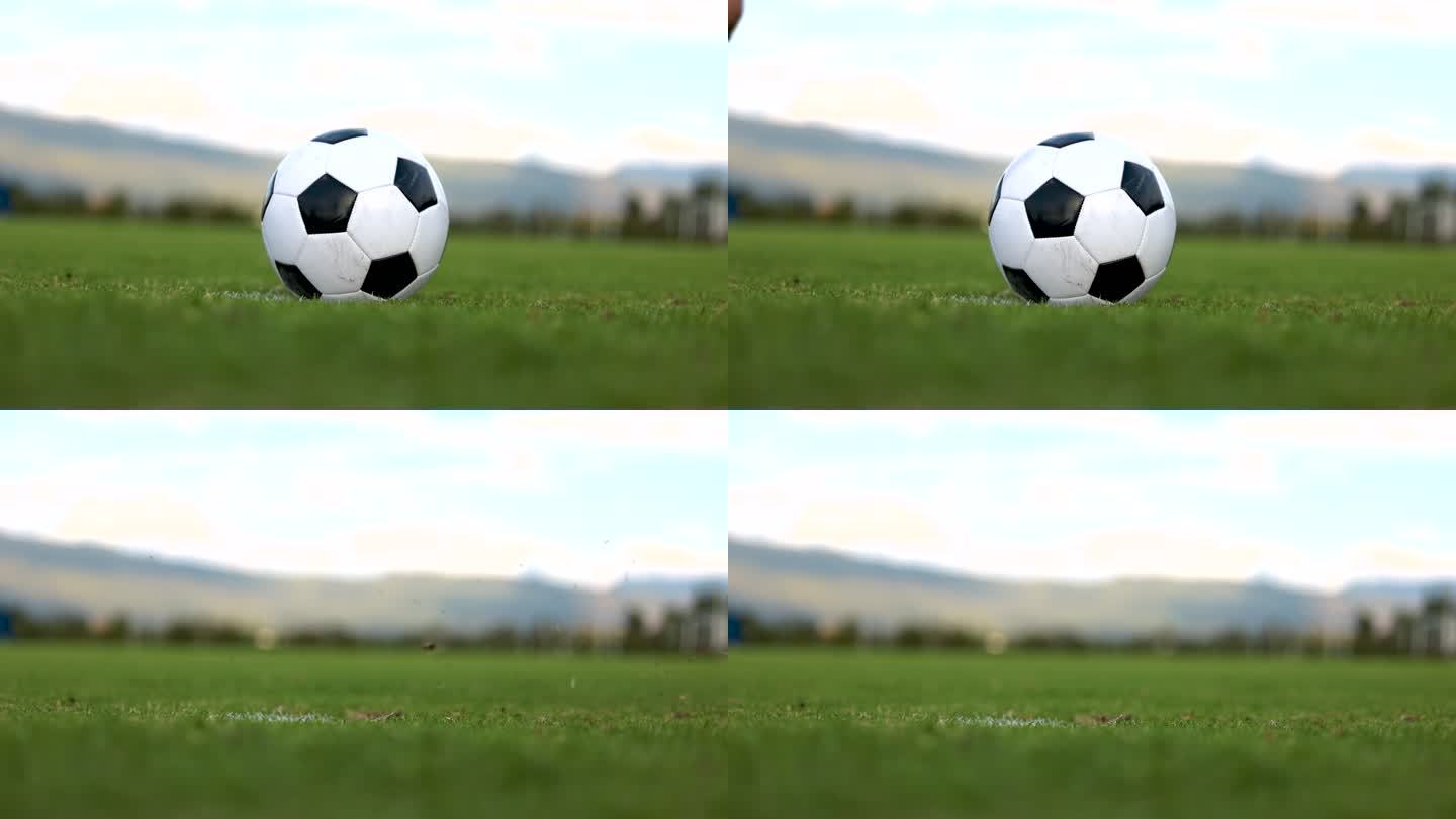 无法辨认的足球运动员在点球时踢足球