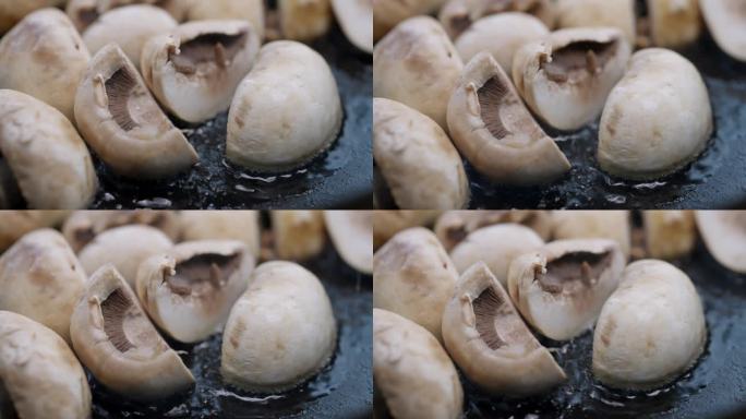 用铸铁平底锅炒蘑菇片