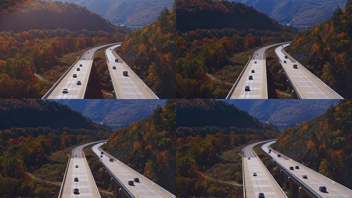 在山上坠落。飞越宾夕法尼亚州收费公路的高桥。带有前向摄像机运动的空中视频