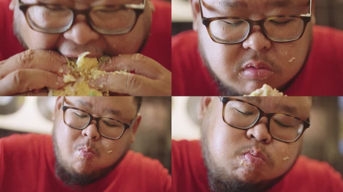 饿得胖乎乎的家伙很快用手吃了一口汉堡包，直到他的脸和嘴都乱了。