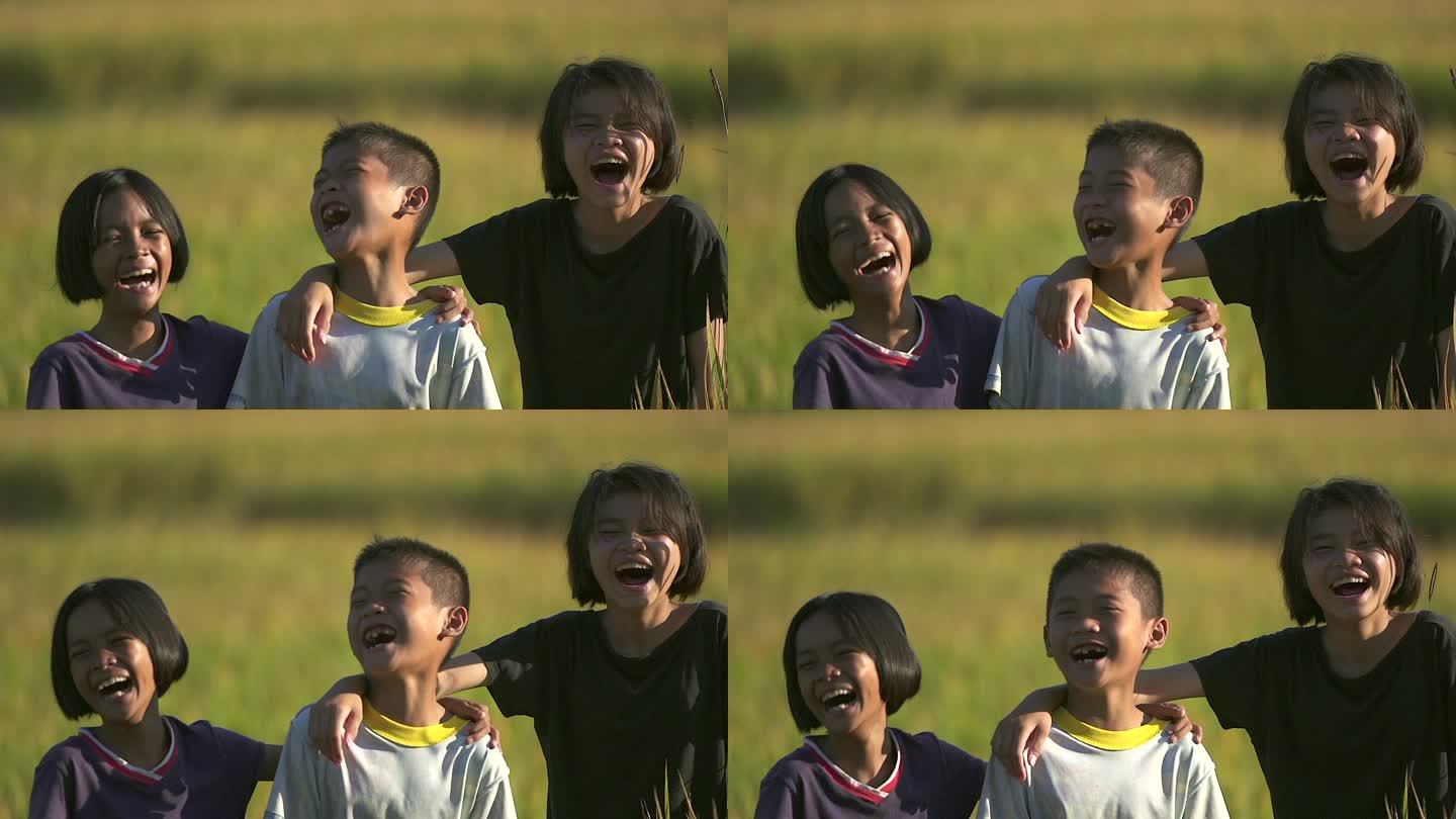 笑容满面，来自东南亚农村的孩子们微笑着，玩得很开心。