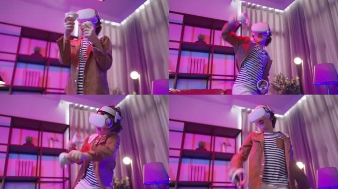 隔离期内，亚洲男童戴着VR或虚拟现实眼镜，戴着耳机站在家里的客厅里，在电视机前玩视频游戏，科技创新概