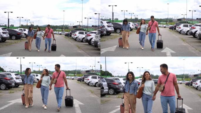 拉丁家庭在机场停车场带着手提箱散步