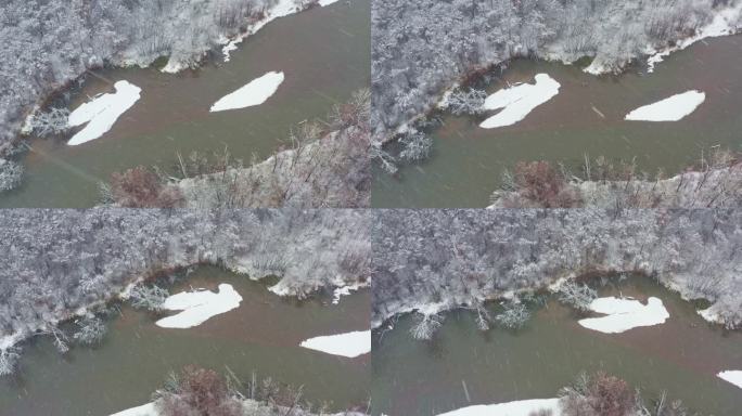 内蒙古大兴安岭初冬下雪中的河流