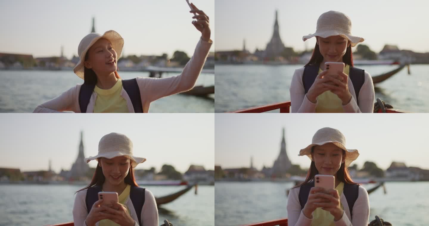 亚洲年轻游客使用手机搜索泰国旅游信息