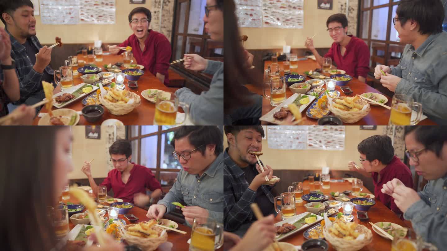 亚洲人在日本餐厅与朋友共度美好时光