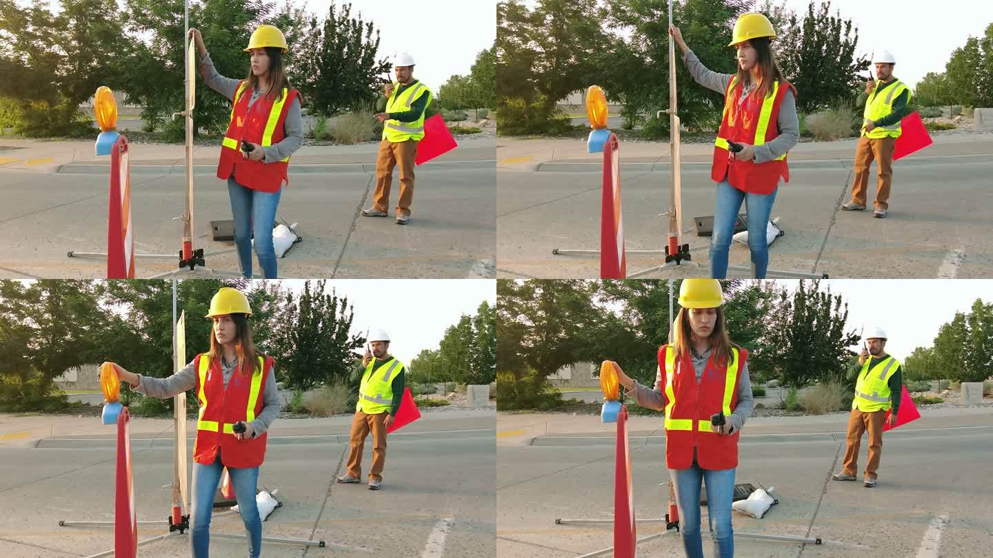 美国西部西班牙裔男性和女性道路施工和维护工人4K视频