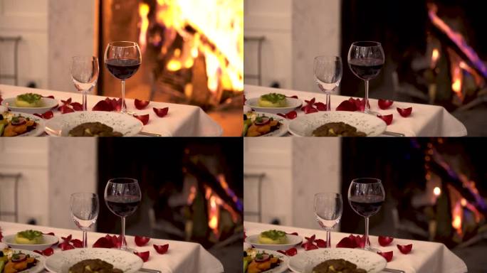 葡萄酒浪漫晚餐玫瑰花烛光晚餐壁炉火焰