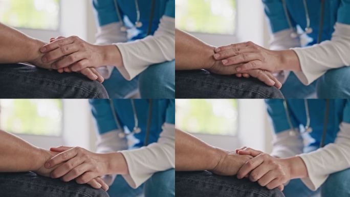 女医生或护士握着老年男性患者的手，特写