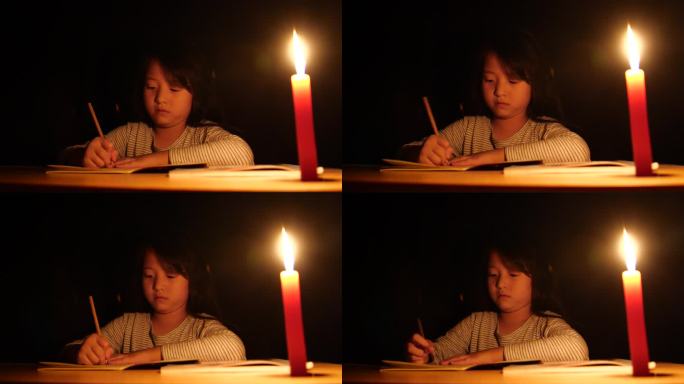点蜡烛写作业停电小女孩烛光学习晚上