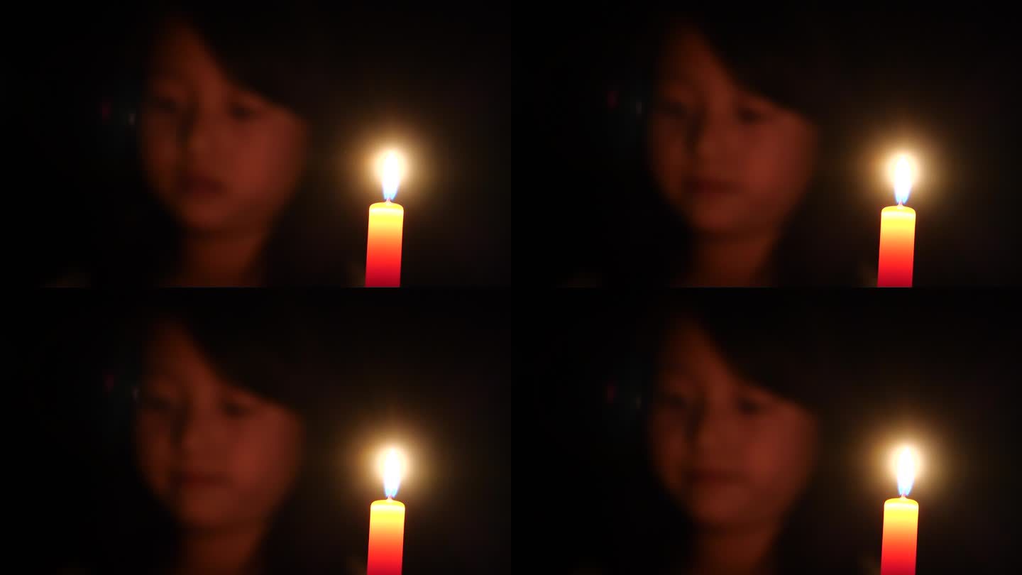 蜡烛红色蜡烛小女孩昏暗灯光
