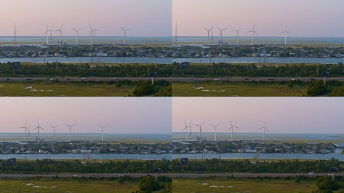 日落时的风电场。美国新泽西州大西洋城，带平移相机运动的鸟瞰图。