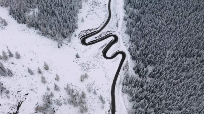 航拍雪山中的盘山公路4K