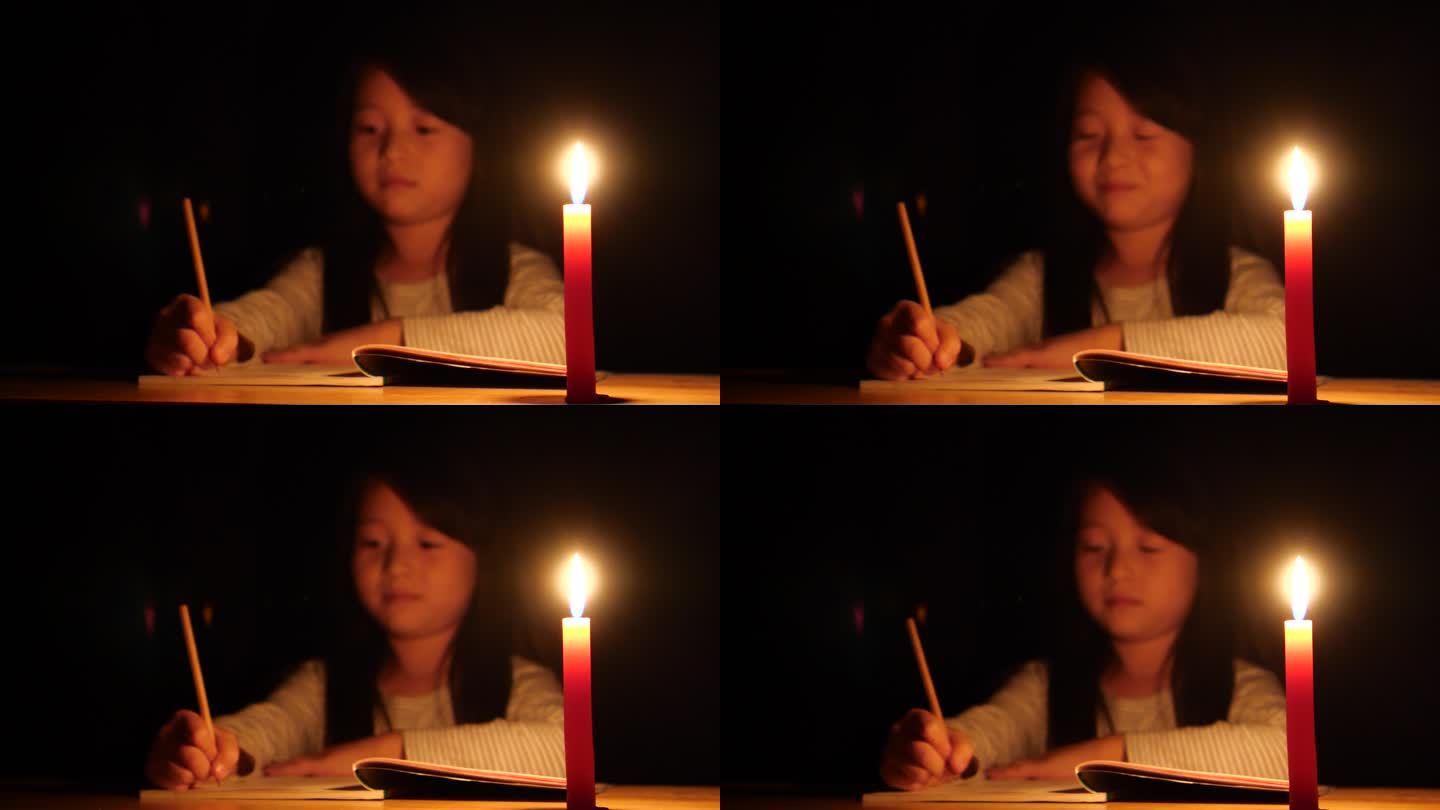儿童小女孩写作业写信点蜡烛