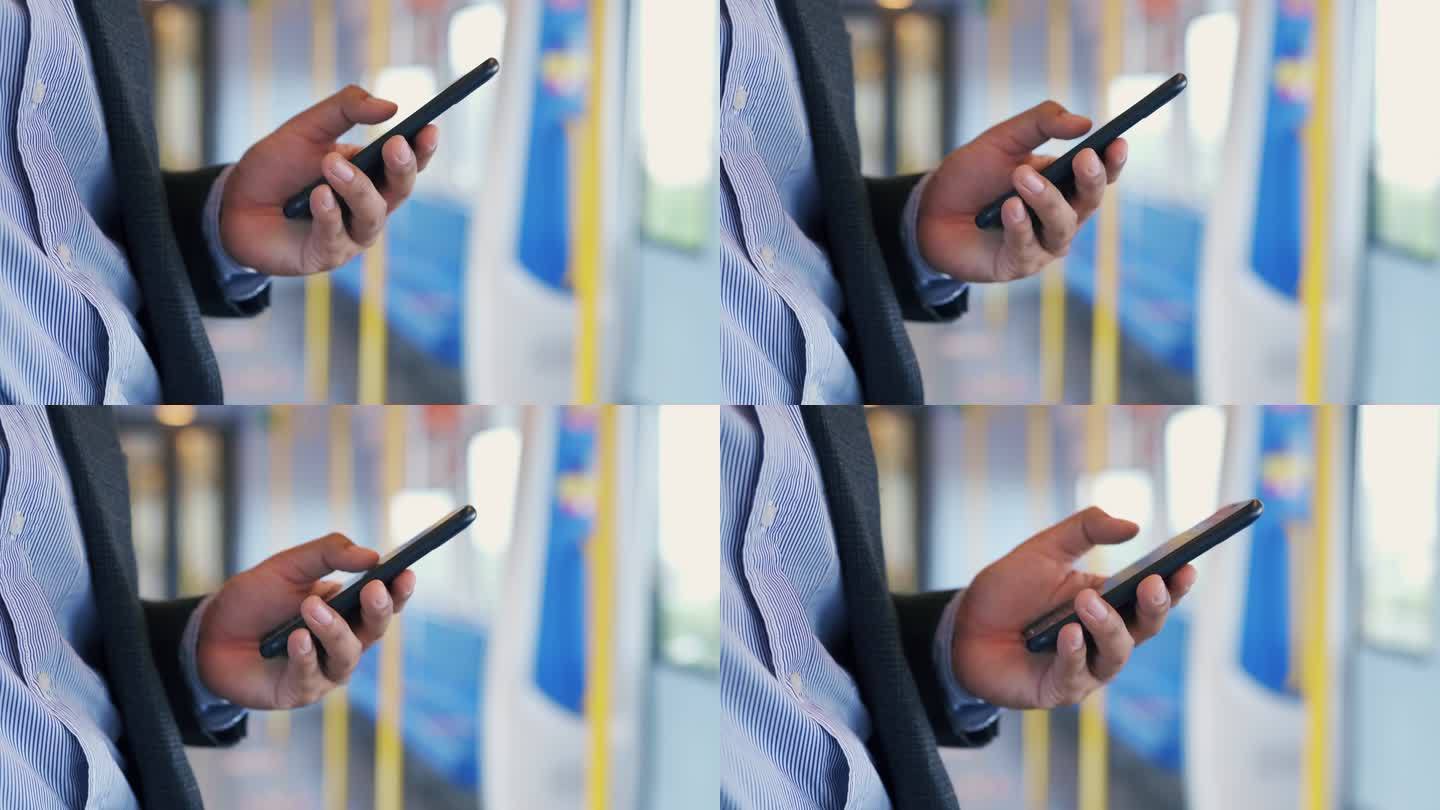 在地铁列车上用手机工作的商务人员视频通话