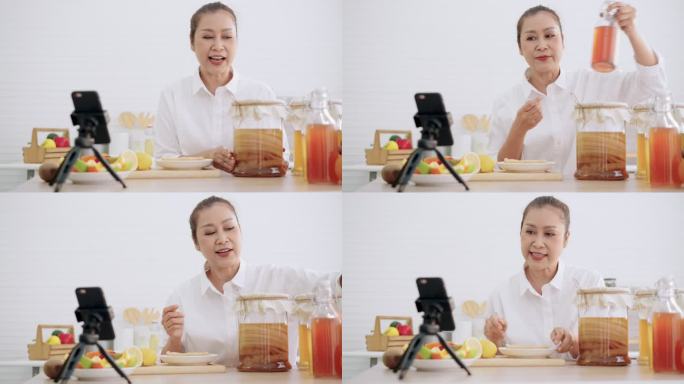 亚洲资深女性影响者，教授如何用不同的调味品制作自制发酵生红茶菌茶。健康的天然益生菌口味饮料，学习使用