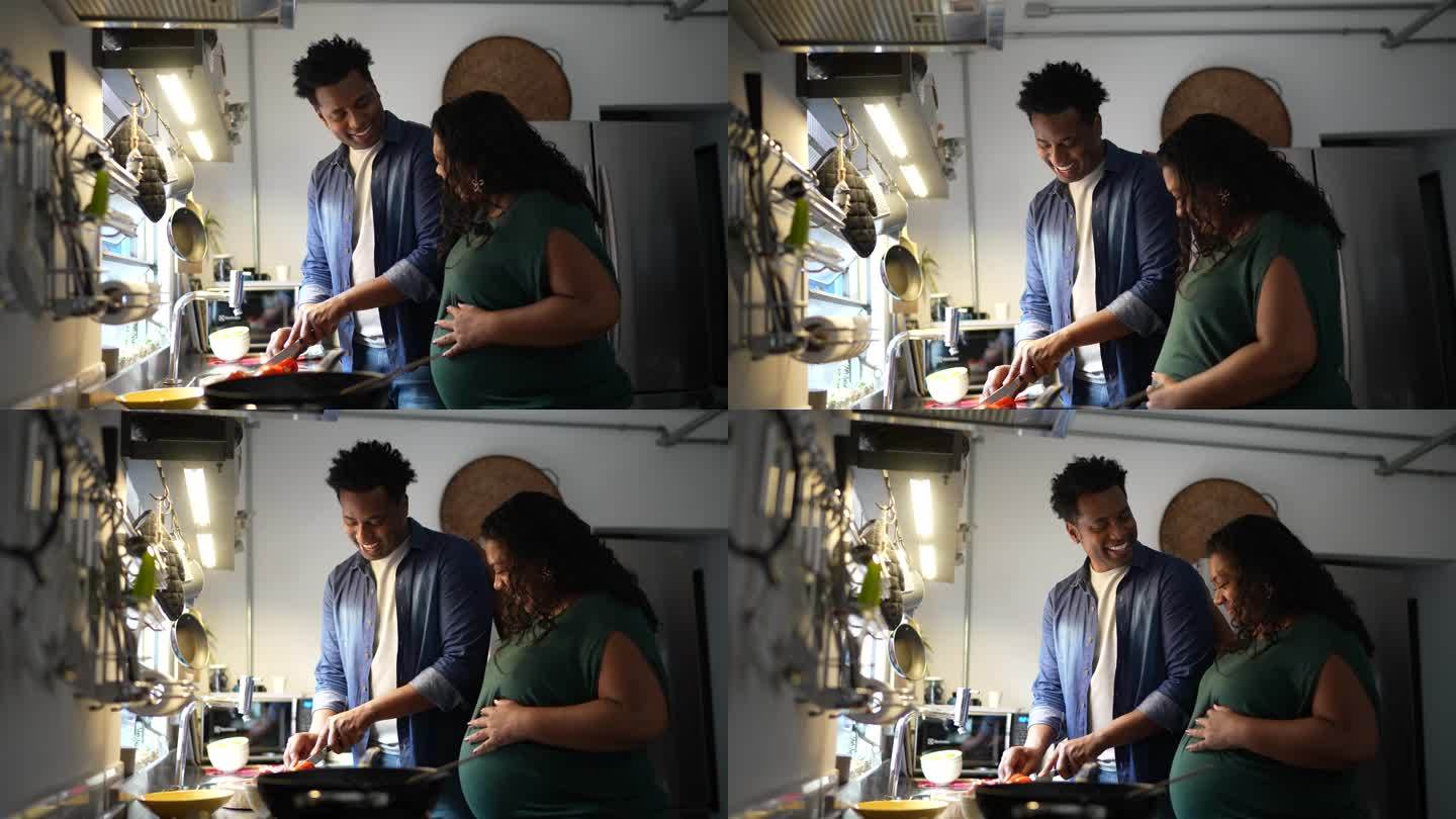 夫妻一起在家做饭烹饪下厨怀孕