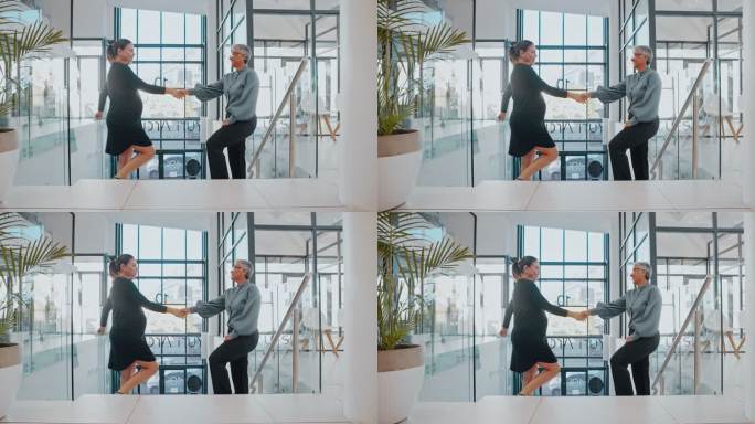 微笑的女商人在办公室楼梯上和怀孕的同事握手。自信的经理用握手来感谢期待的同事或祝她产假好运