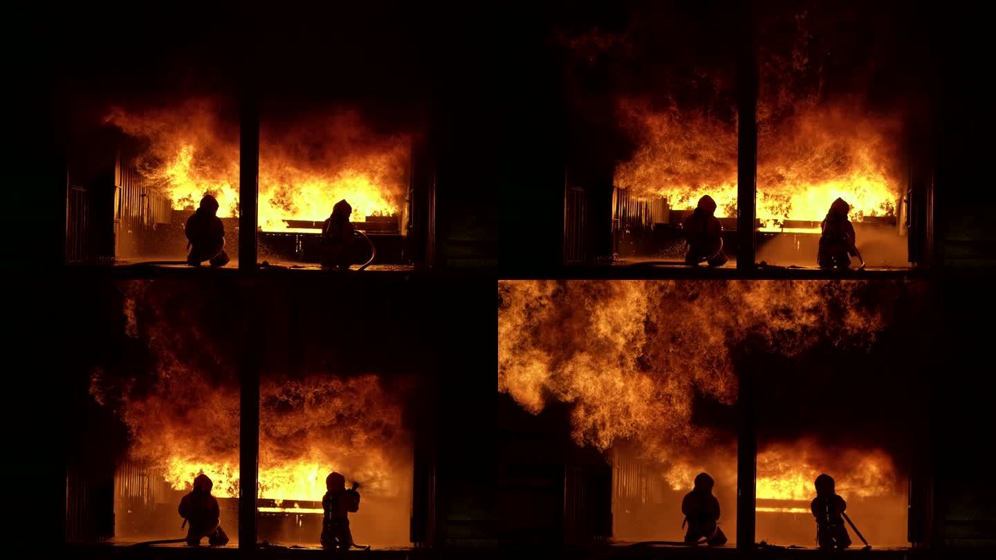 4k UHD消防员使用水雾灭火器扑灭大型建筑内的火焰。消防员和工业安全灾难及公共服务理念。