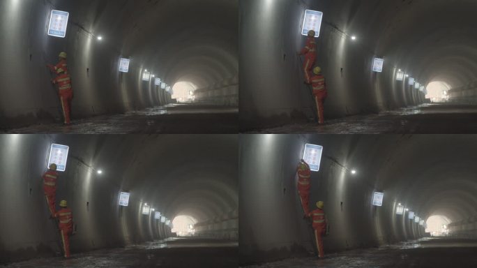 隧道里 工人 施工 安装 安全标志牌