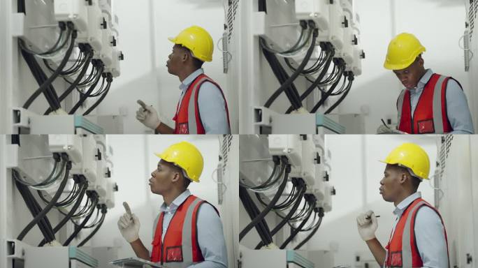 非裔美国工程师或专业技术人员具有领导能力、经验、工程专业知识，在工厂控制室工作。检查和控制公用系统。