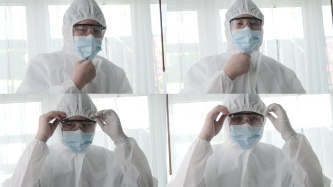 新冠肺炎期间，实验室工作人员在工作前穿戴防护用品，健康生活方式理念。