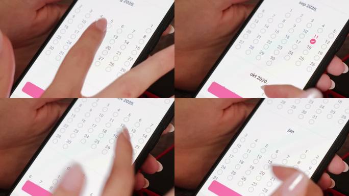 使用智能手机日历应用程序的女性手特写