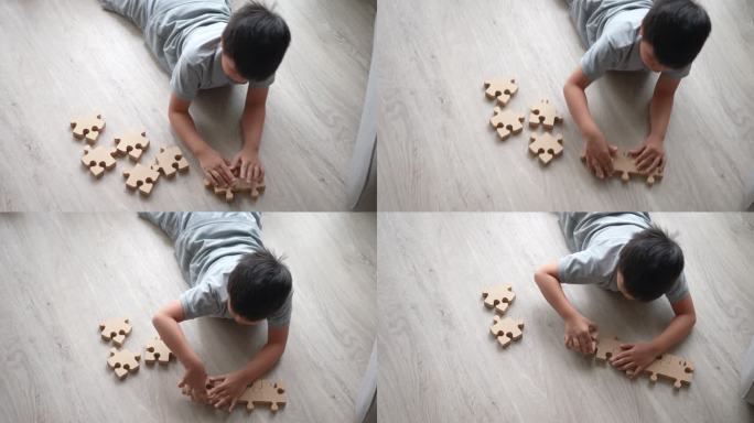 亚洲男孩玩创意玩具和益智玩具。发现、创意和解决方案的概念