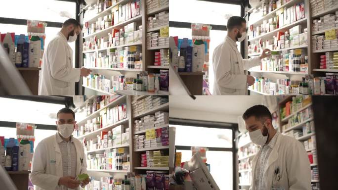 新冠肺炎大流行期间，男药剂师戴着防护口罩在药店的电脑上查看药物价格