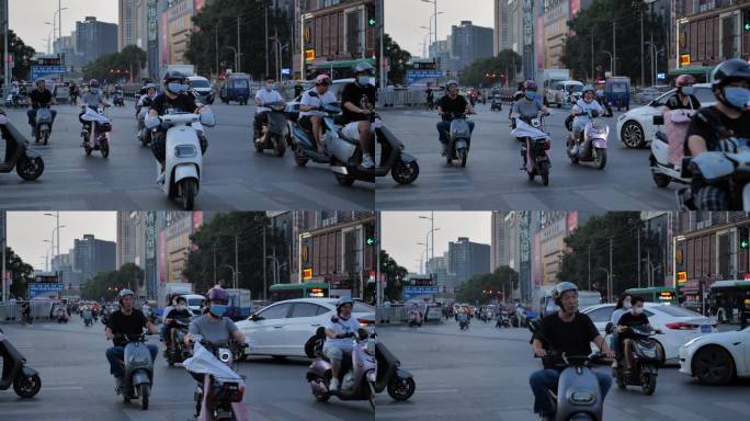 城市电动车骑行穿梭过马路