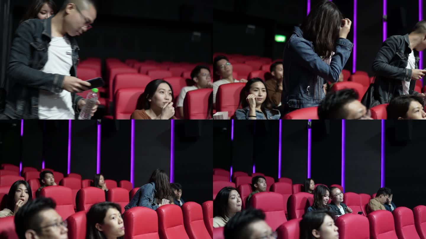 在电影放映期间，进入电影院大厅的亚裔中国夫妇经过其他观众到达座位
