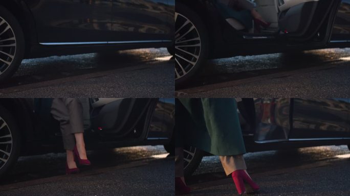 一只穿着时尚红色高跟鞋的女性脚从商务舱车上下来的特写镜头