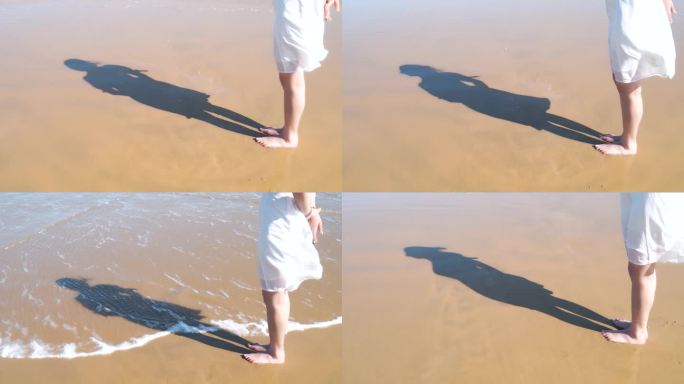 沙滩上影子一个人在海边看海背影影子阳光海