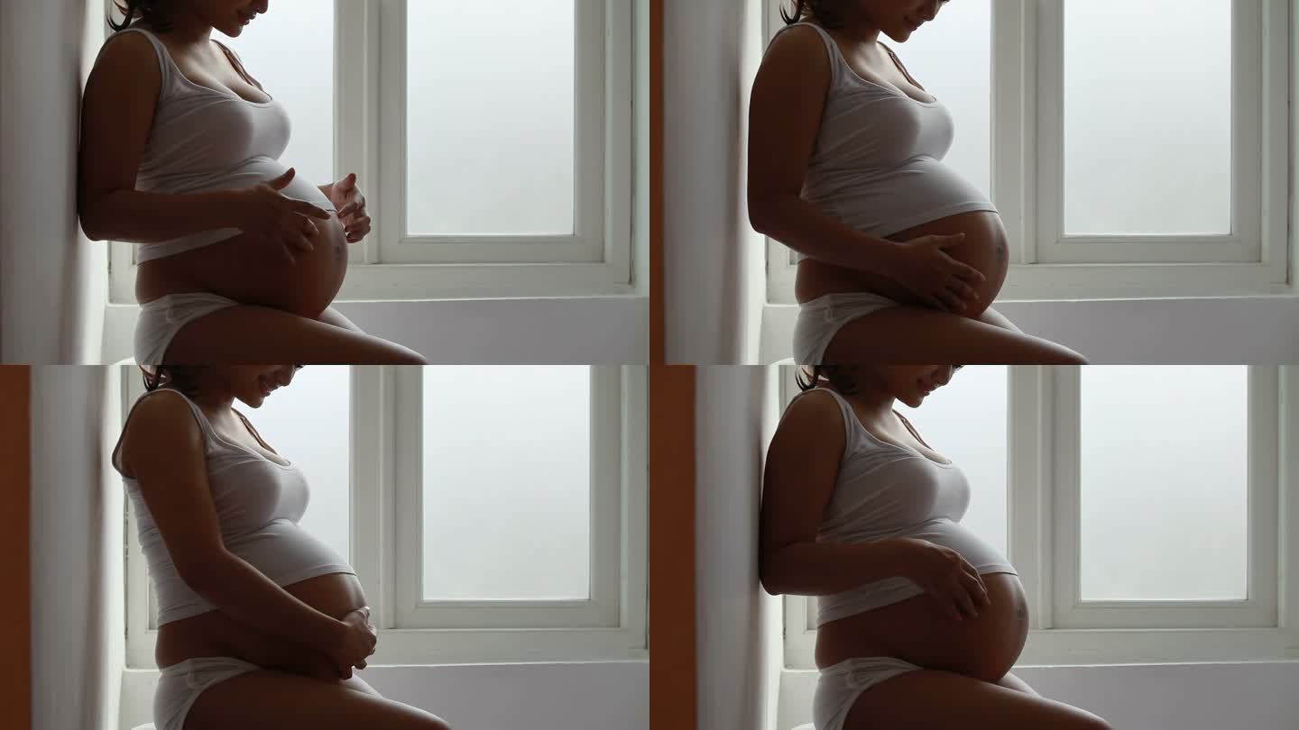 带窗灯的孕妇孕妇窗台摸肚子母爱