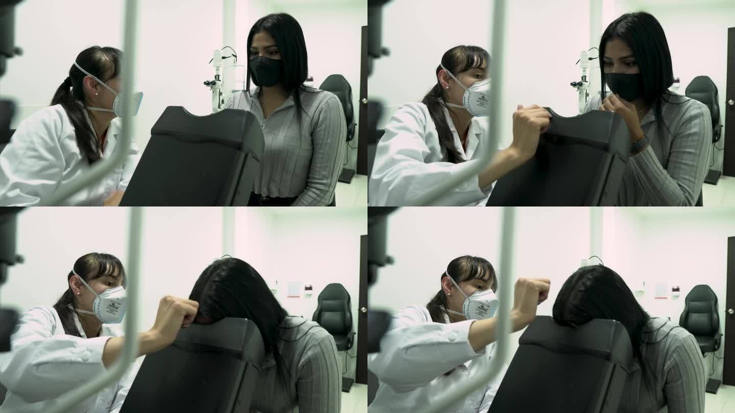 拉丁妇女，专业医生，用最先进的机器对患者进行目视检查