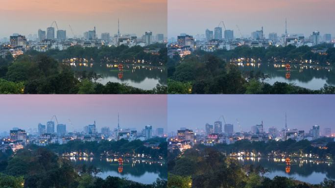 河内日落景象日复一日的拍摄。城市中心的海龟塔和Hoan Kiem湖照明。越南黑水中反射的彩色灯光