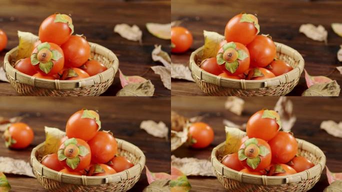 柿子在篮子里展示叶子落下
