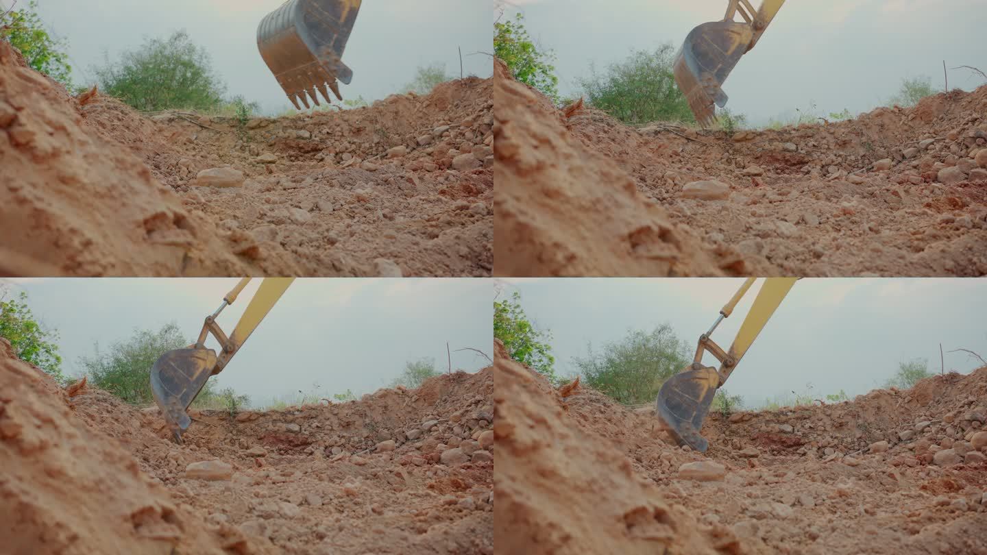 反铲；自然背景下施工现场的挖掘机