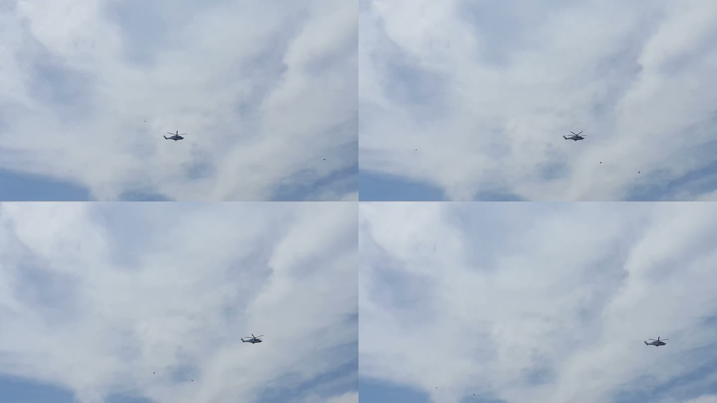 直升飞机在天空中迎云飞行