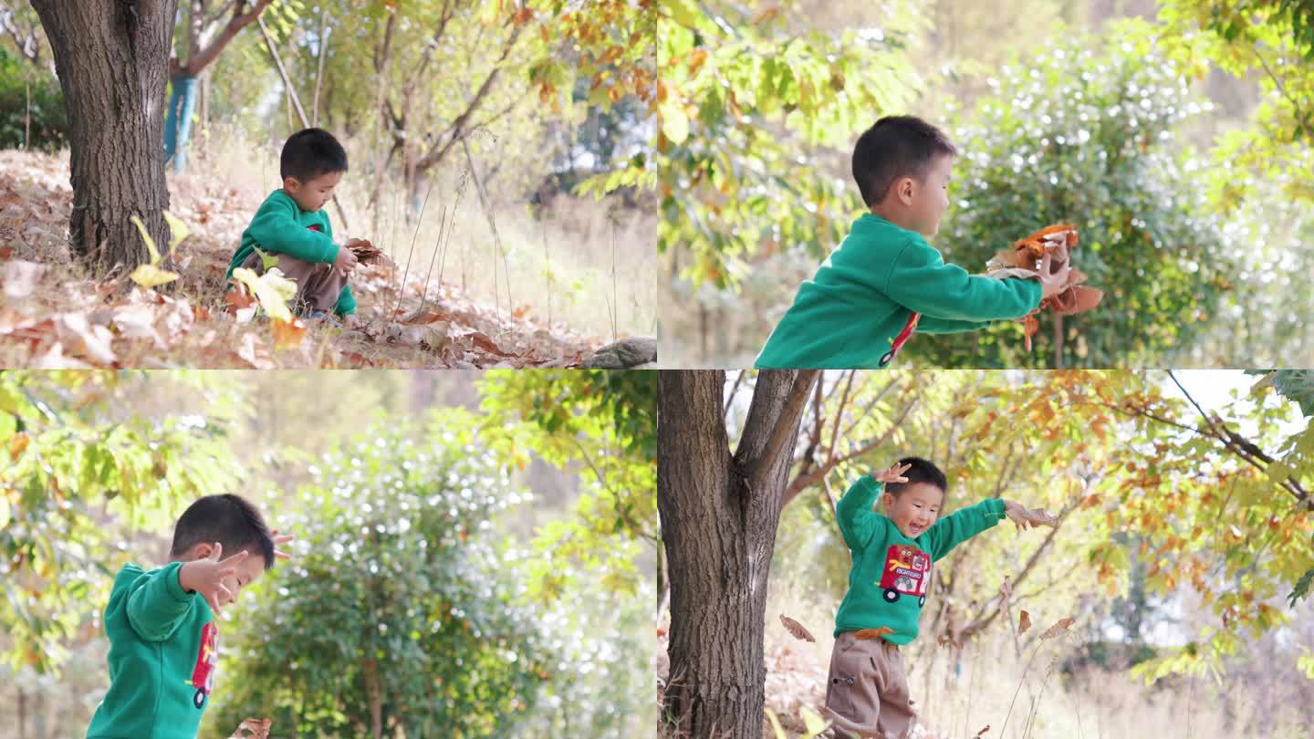 4K秋天阳光下一个可爱小男孩撒树叶慢动作