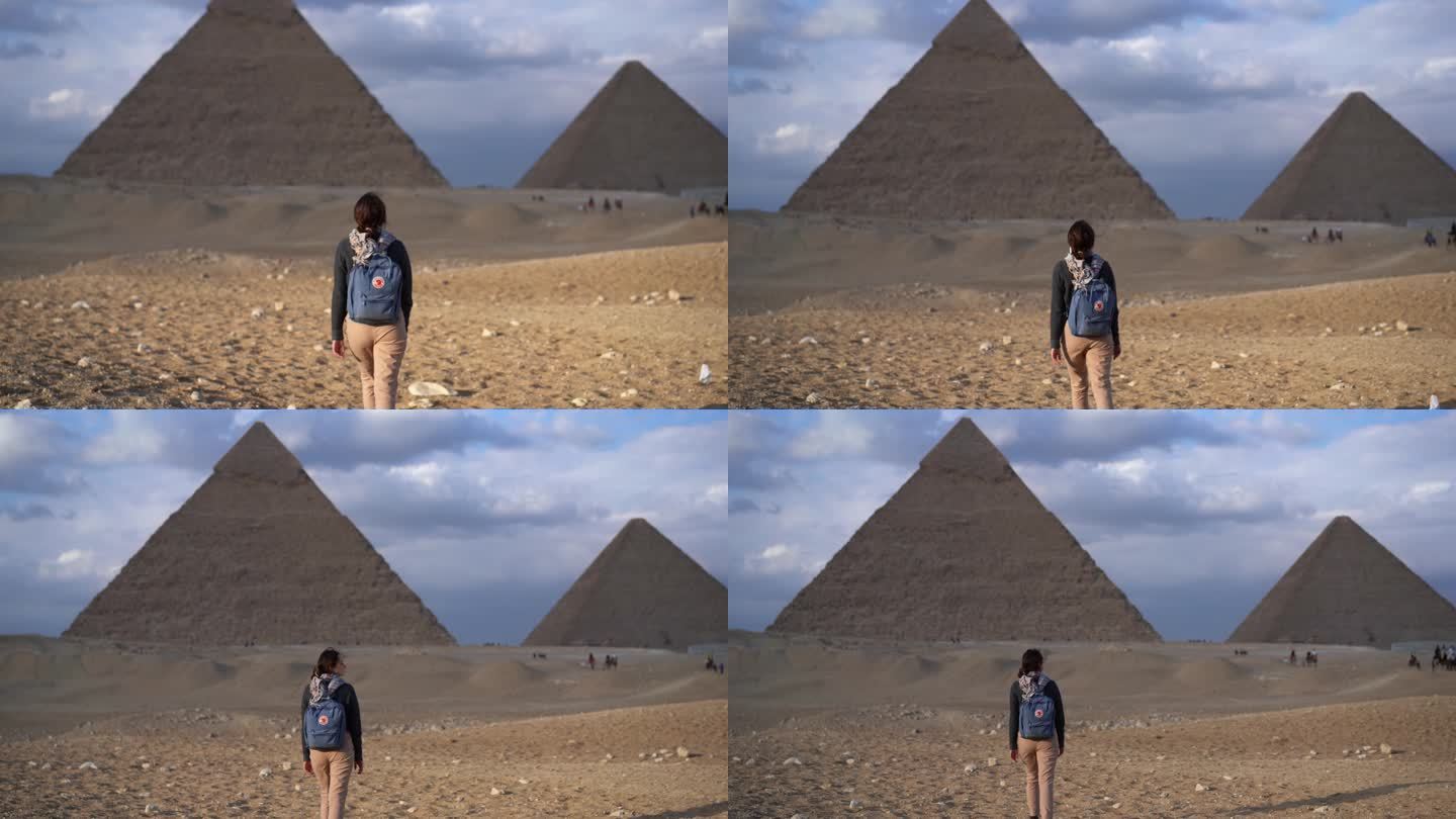 站在吉萨金字塔附近的女人