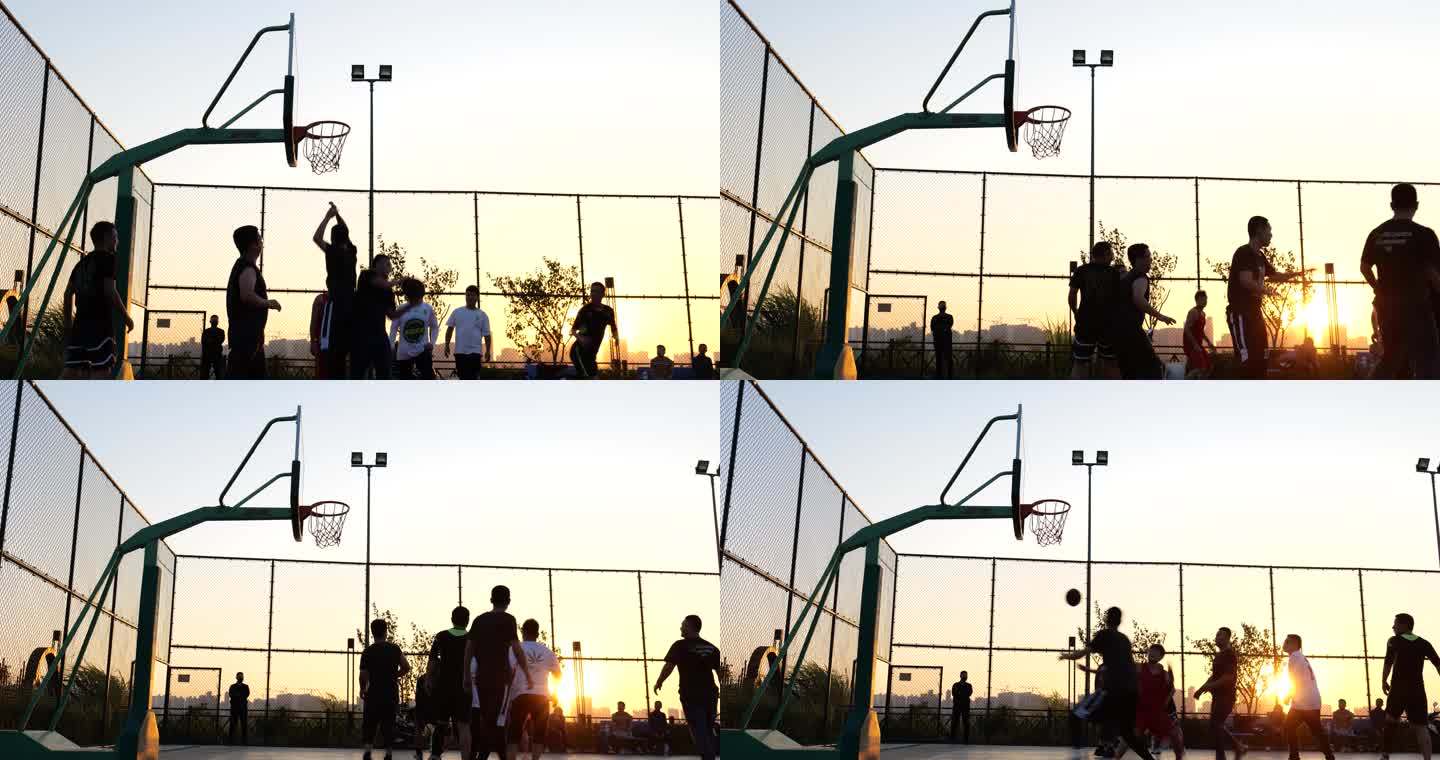 夕阳下打篮球的人