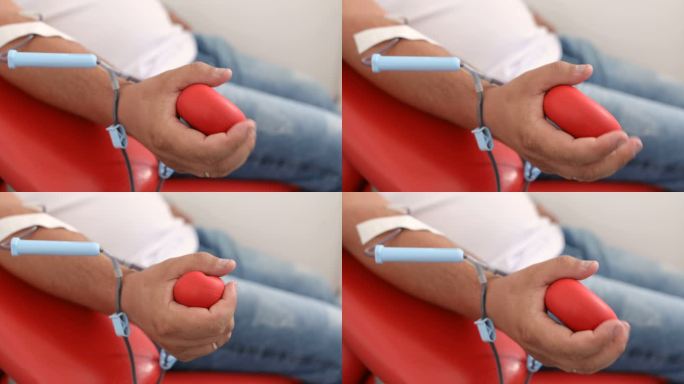 干得好。献血对身体的好处。接受输血者的手。医疗诊所献血者特写
