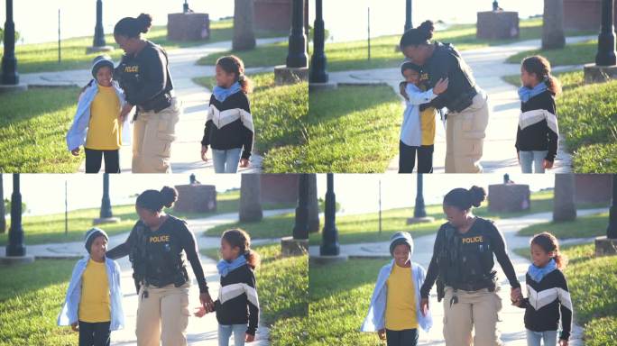 社区里的女警察，带着两个孩子散步