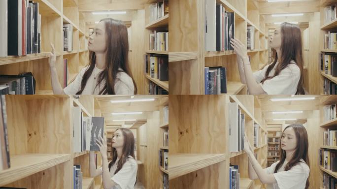 年轻的亚洲女大学生在图书馆找书（慢动作）