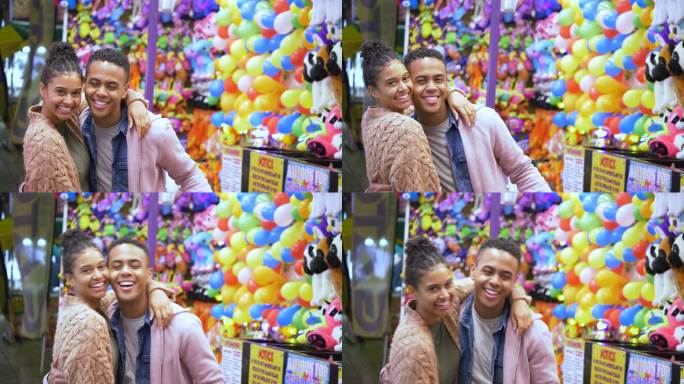 狂欢节游戏中的年轻黑人夫妇，对着镜头微笑