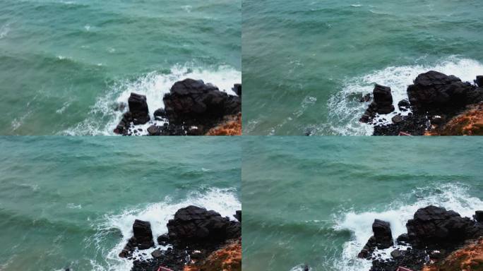航拍俯视海浪拍打礁石