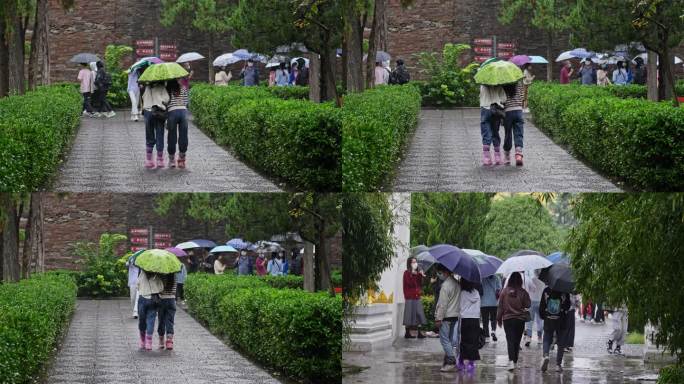 雨天景区行人打伞