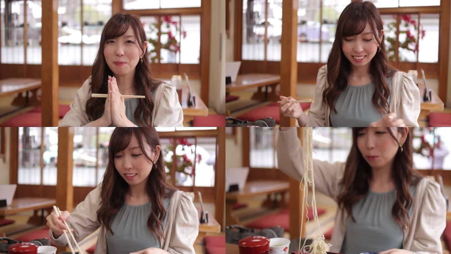 一位年轻女子在日本餐厅祈祷并吃着荞麦作为午餐
