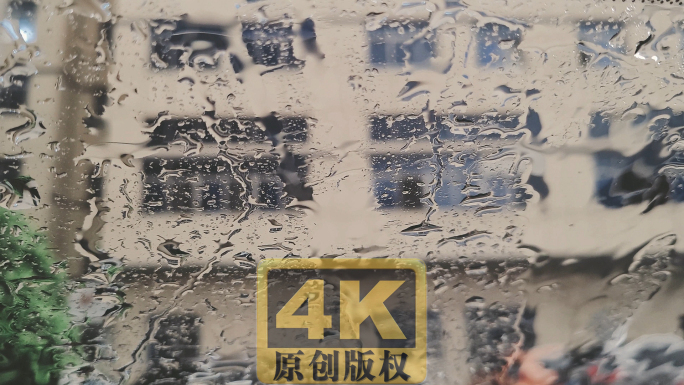 窗户上的雨水雨滴实拍4K视频素材